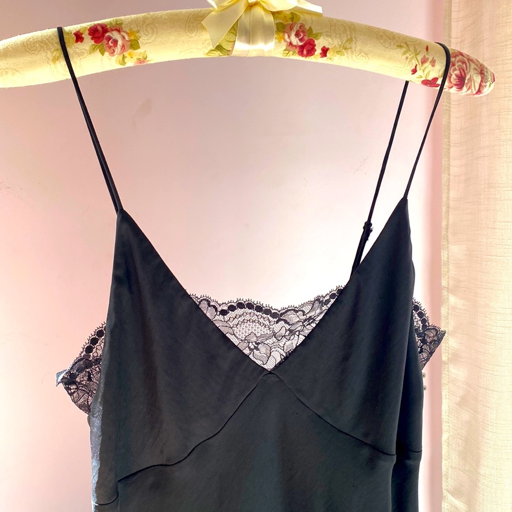 Black silk maxi dress with lace details.